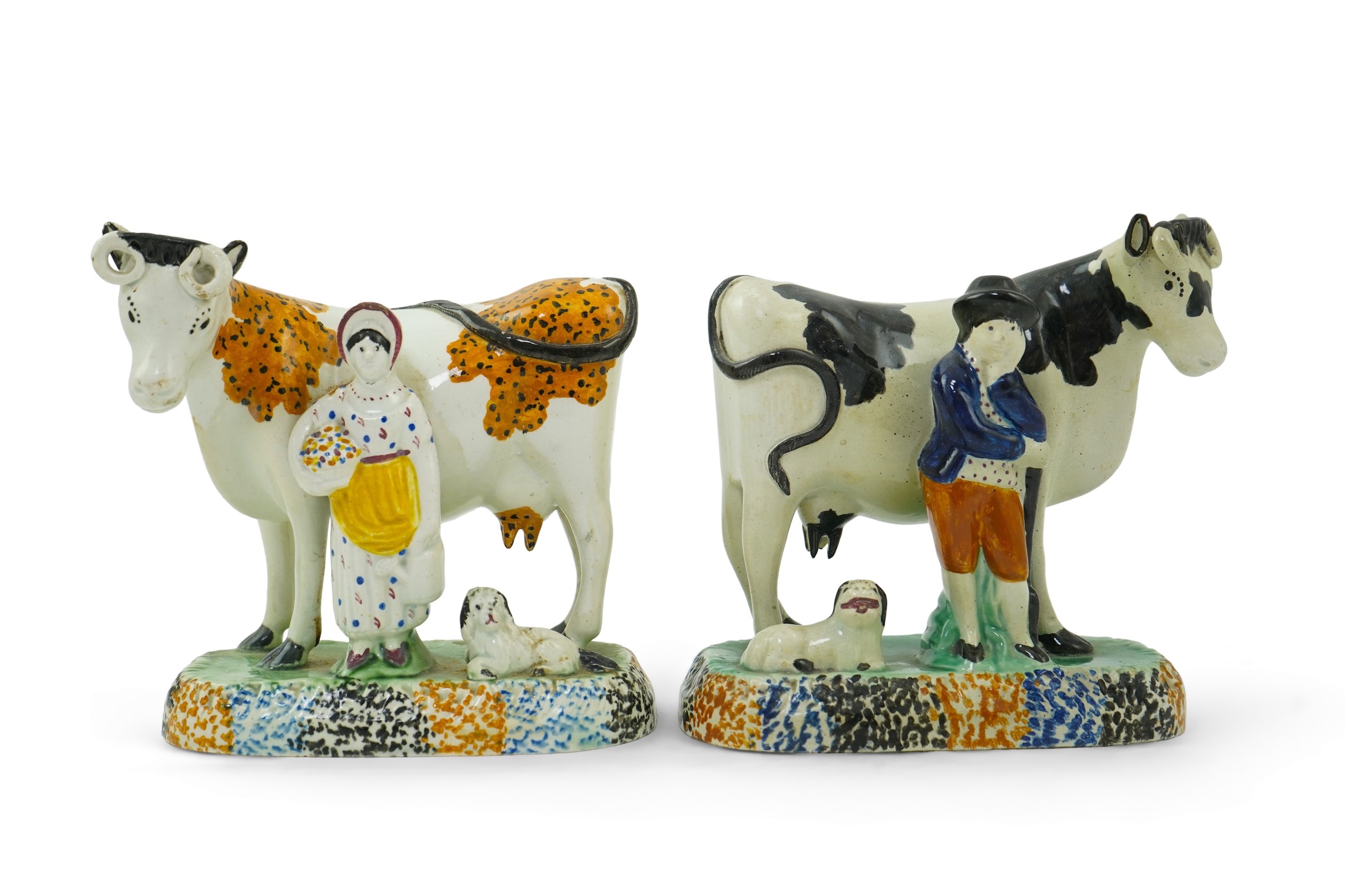 Two Yorkshire Prattware cows, with farmer or milkmaid and dog groups, c.1810